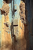 Bakong temple - detail of sandstone decoration of the ancillary tower.